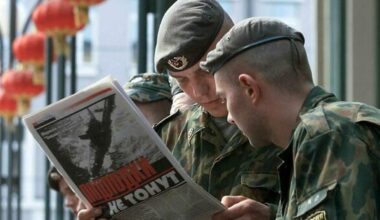 epa12293546 (FILE) -Russian soldiers read a newspaper with the headline "Submarines don