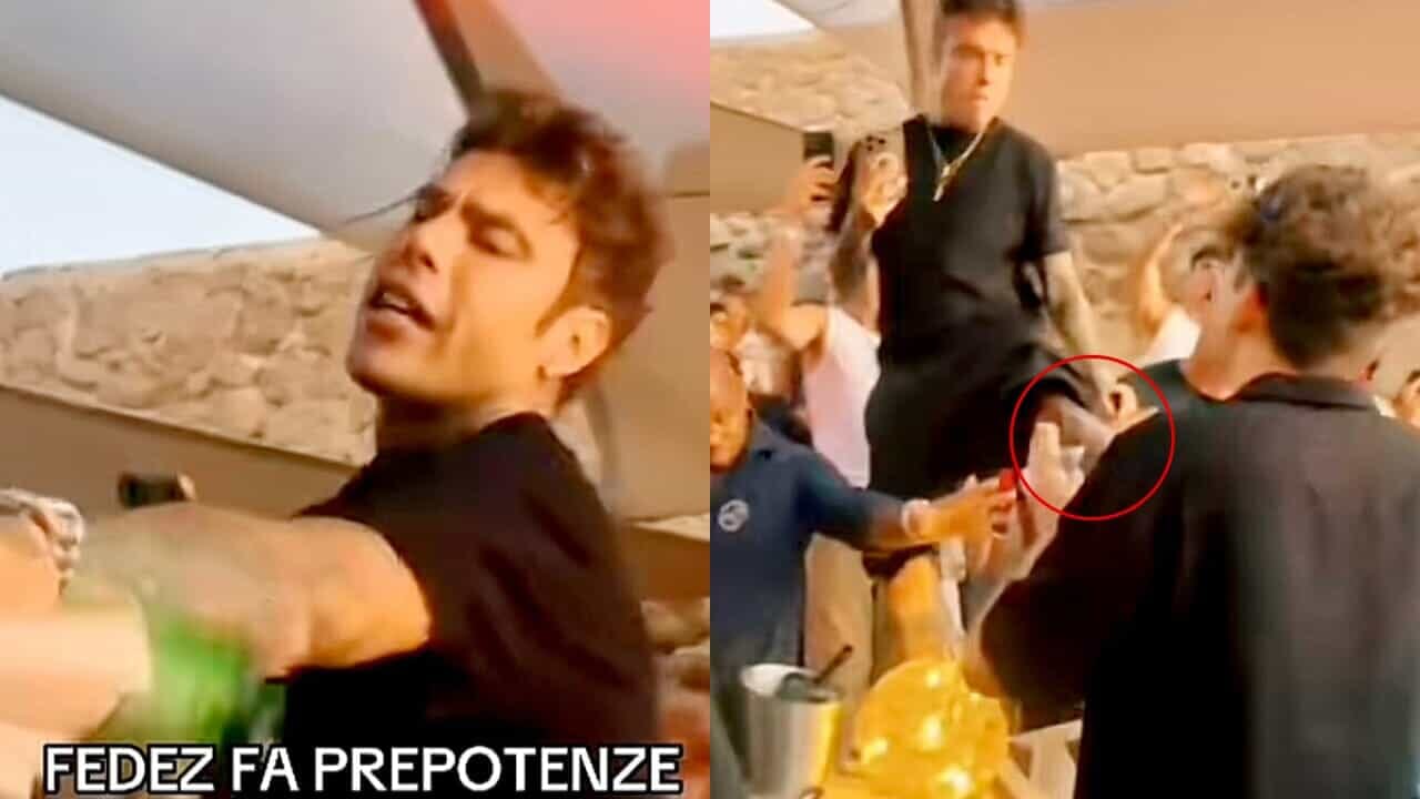 Fedez tira un calcio a un giovane che lo riprende col cellulare in un locale: il video