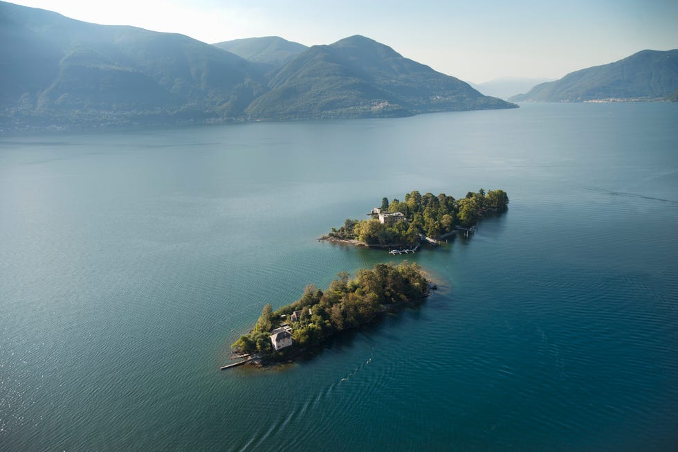 lake maggiore is a large lake located on the south side of the alps. it is the second largest of italy and largest of southern switzerland. lake maggiore is the most westerly of the three great prealpine lakes of italy, it extends for about 70 km between locarno and arona. the climate is mild in both summer and winter, producing mediterranean vegetation, with beautiful gardens growing rare and exotic plants. well known gardens include those of the isola madre, isola bella and the isole di brissago, that of the villa taranto in verbania, and the alpinia botanical garden above stresa.
