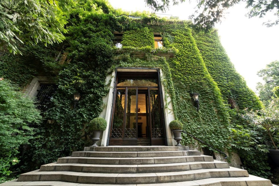 villa-mozart-milano historic building with ivycovered facade and steps leading to the entrance