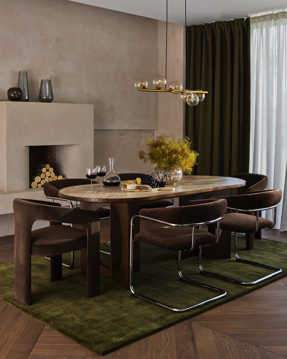 brown dining chairs with chrome frame and moss green rug in dining area, john lewis autumnwinter 2025 modern luxe