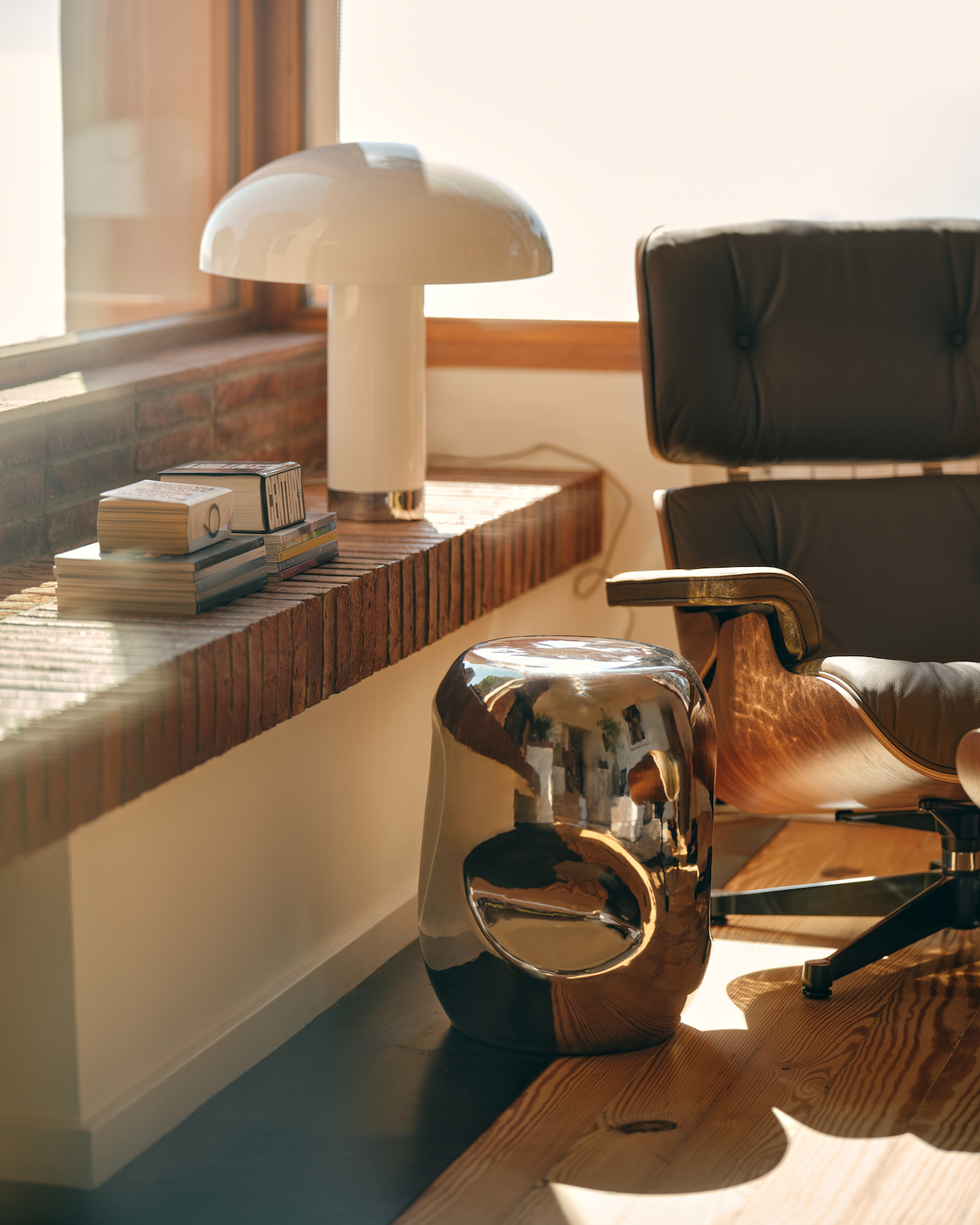 chrome side table in living room corner