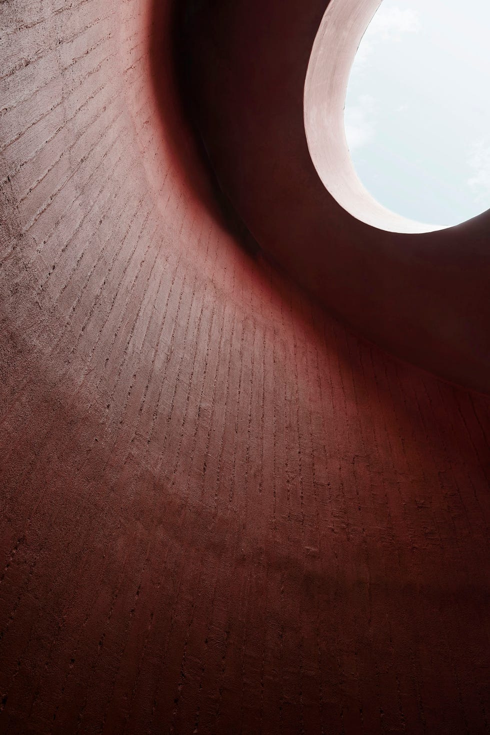 interior design featuring curved walls with a skylight