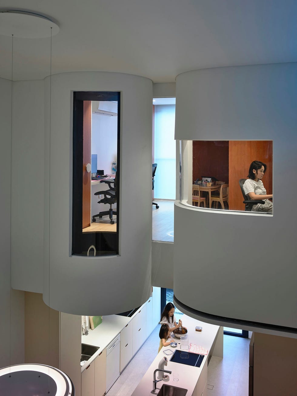 modern interior of a multilevel home featuring unique circular spaces