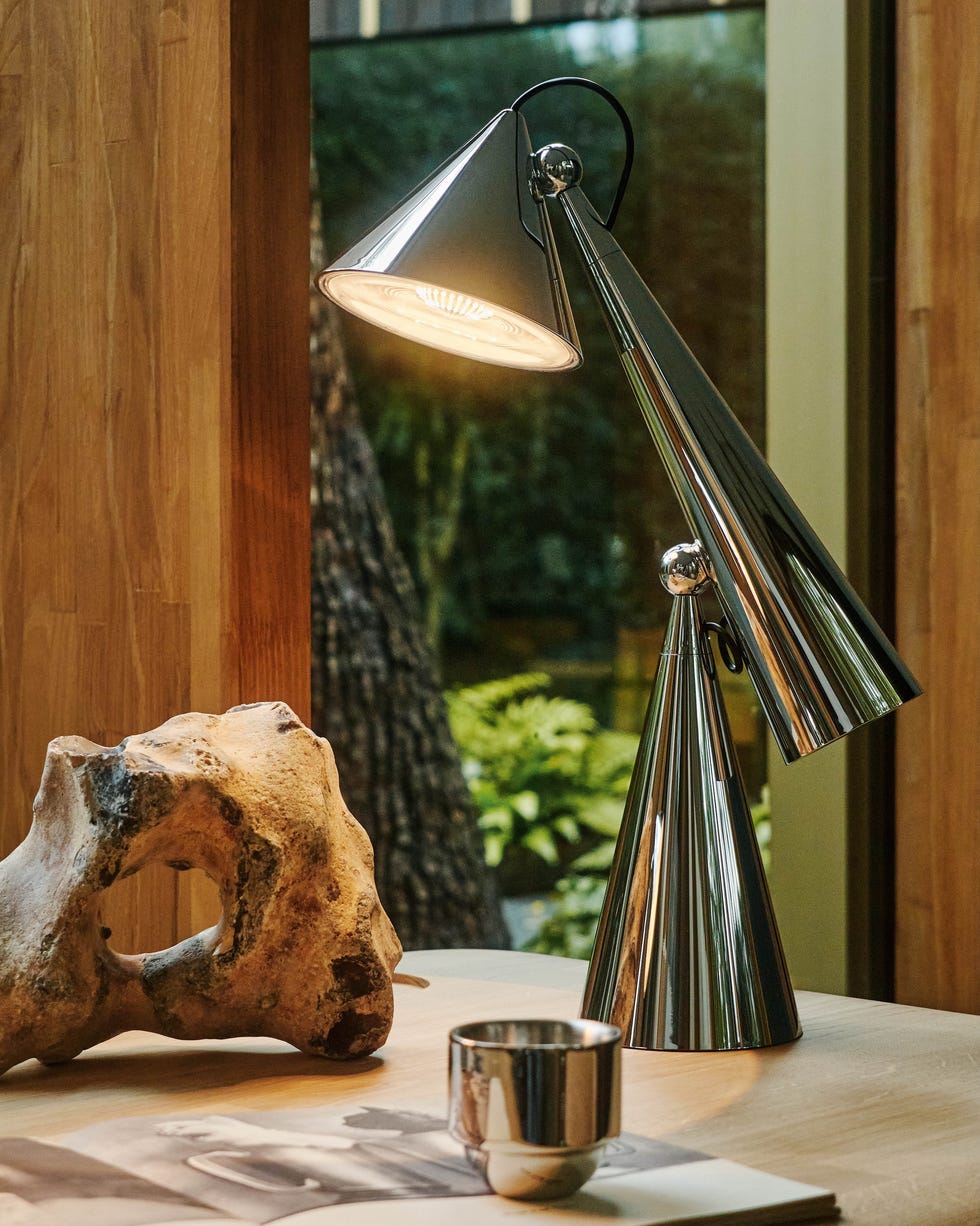 tom dixon's chrome pose task light on table