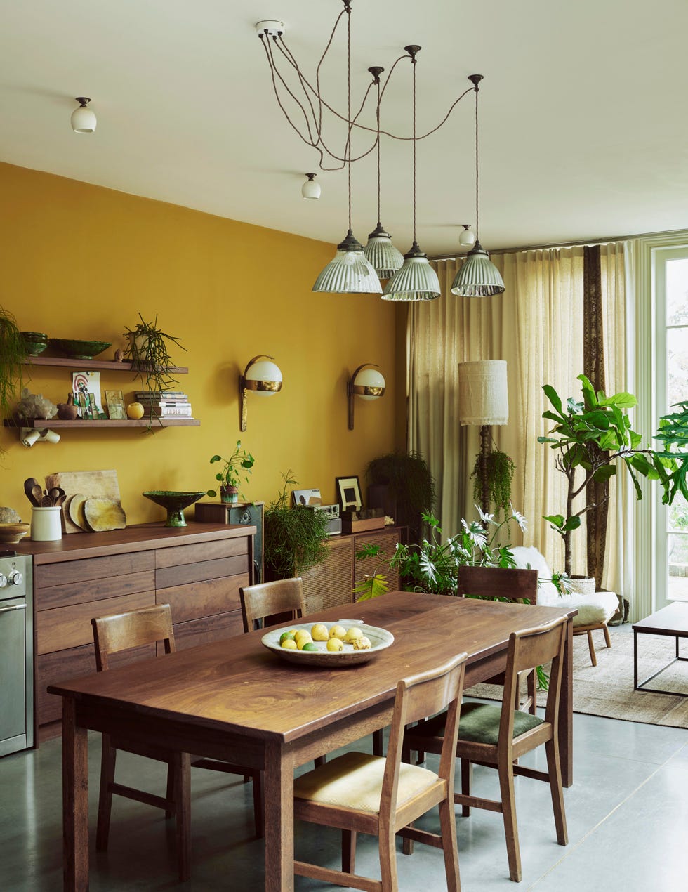 eclectic dining room open plan kitchen with yellow walls