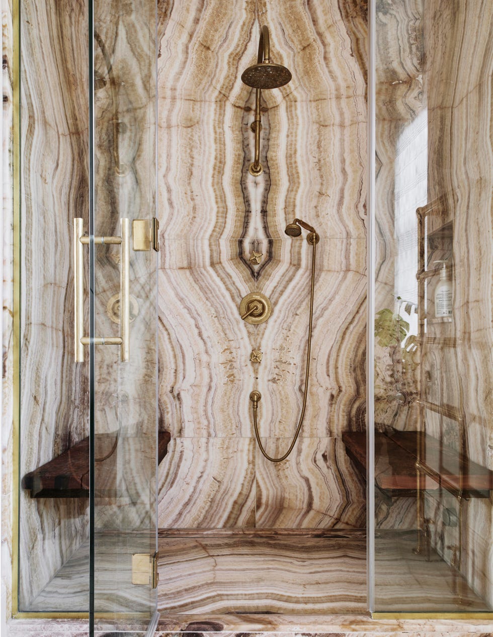 glamorous marble clad bathroom and walk in shower