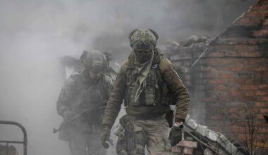 Infantry recruits of the 28th Seperate Mechanized Brigade take cover from a grenade blast as they undergo a basic training course at an undislosed location in eastern Ukraine on October 9, 2025. (Photo by Ed JONES / AFP)