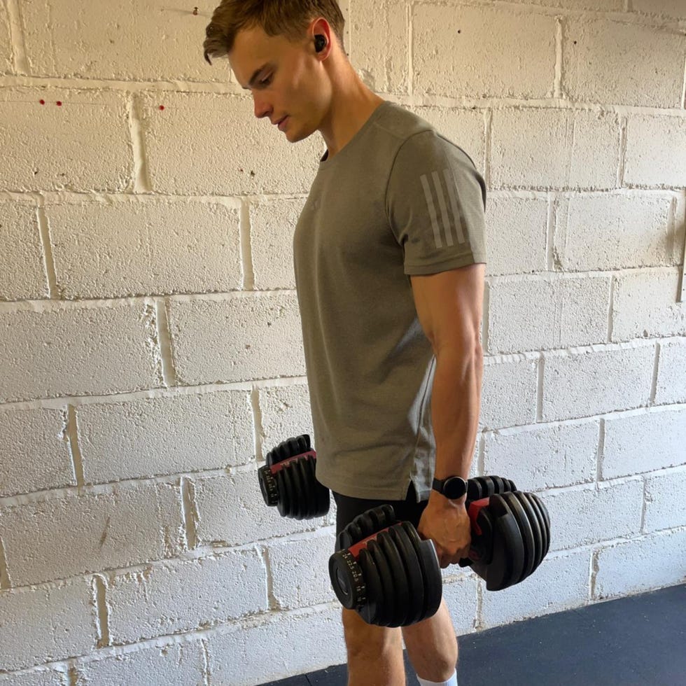 weightlifting session demonstrating dumbbell exercise