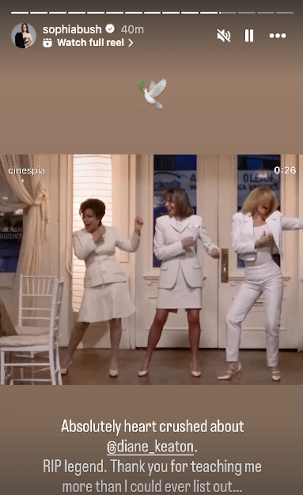 three women dressed in white performing a dance routine