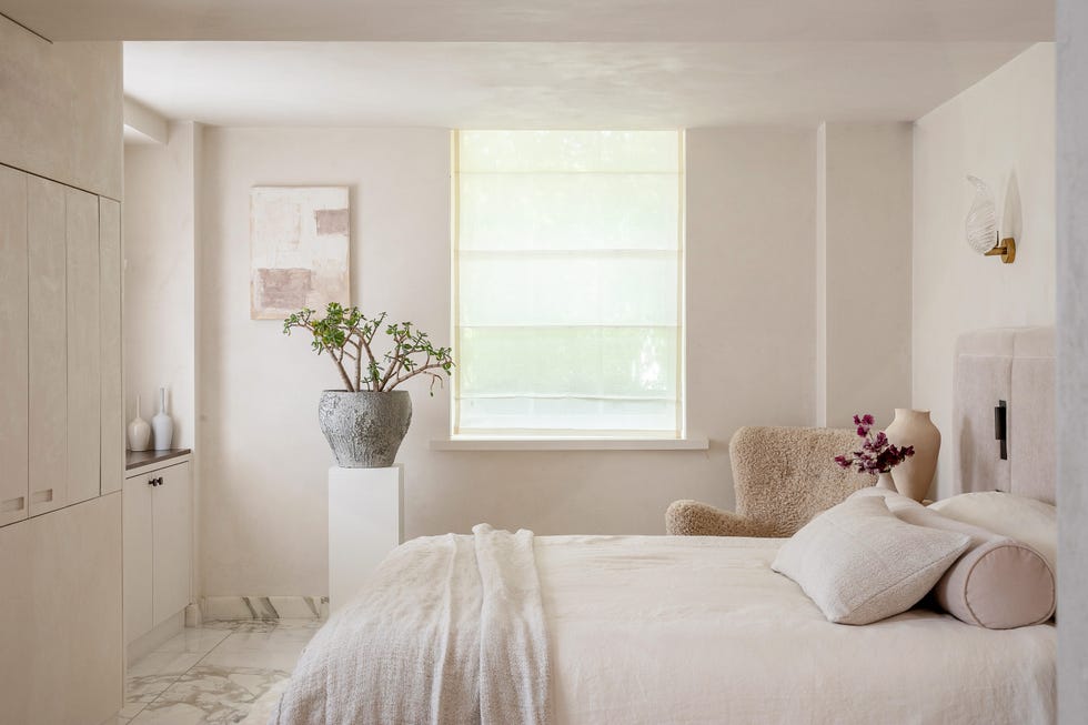 bedroom with neutrals and pink