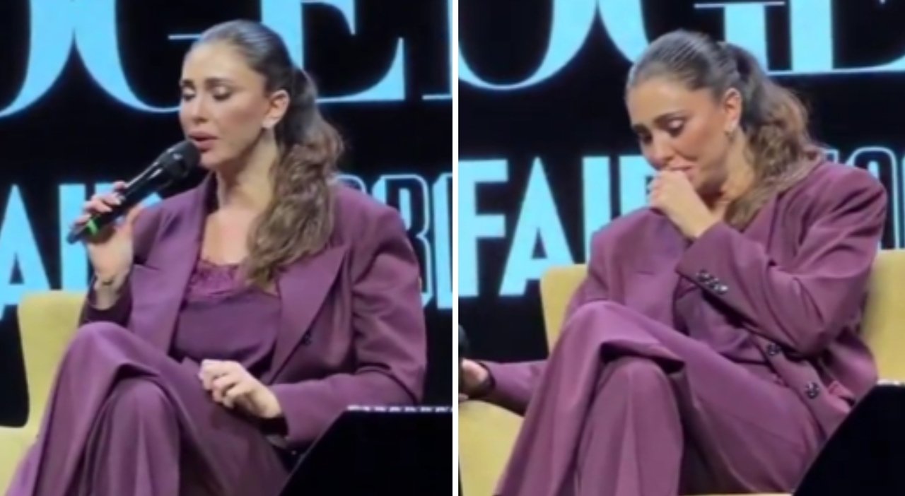 in difficoltà durante l'intervista, accompagnata fuori a braccetto