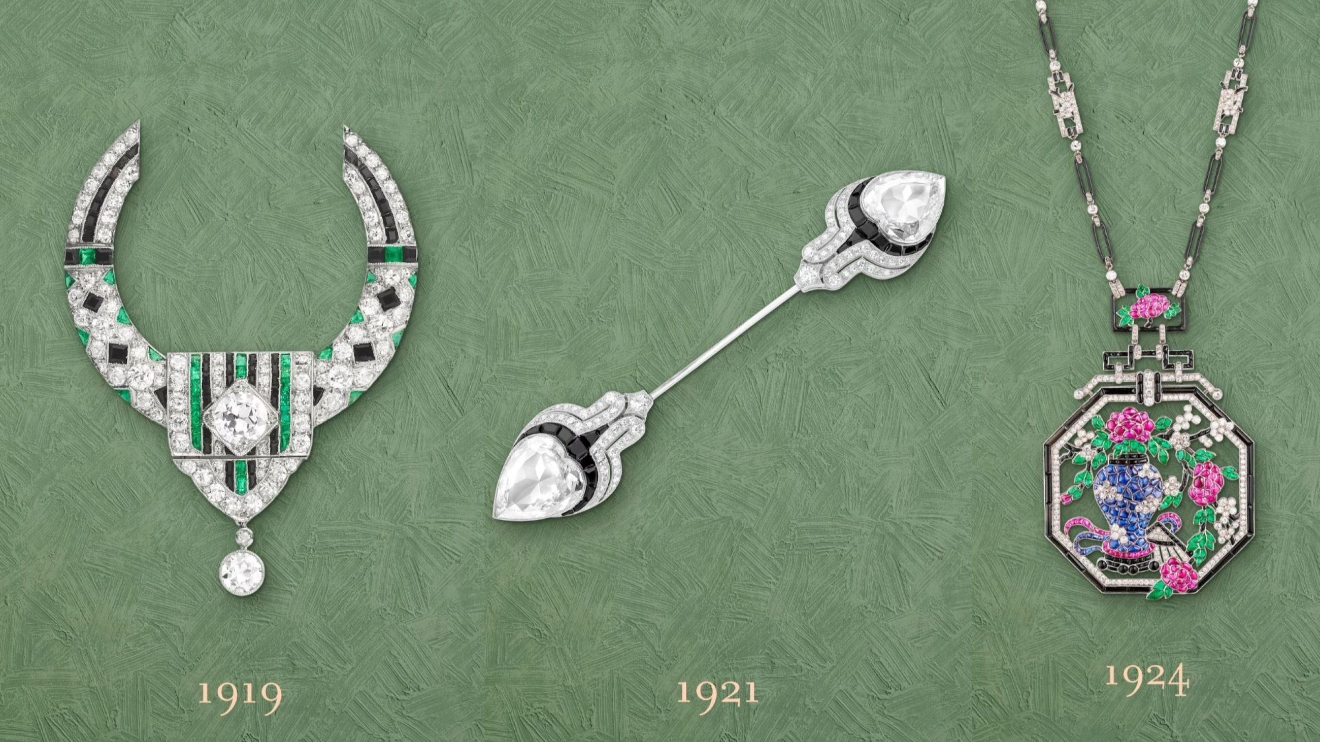 Loop brooch, 1919, Platinum, emeralds, onyx, diamonds, Van Cleef & Arpels Collection; Brooch, 1921, Platinum, onyx, diamonds, Van Cleef & Arpels Collection; Sautoir, 1924, Platinum, emeralds, rubies, sapphires, onyx, enamel, diamonds, Van Cleef & Arpels Collection 