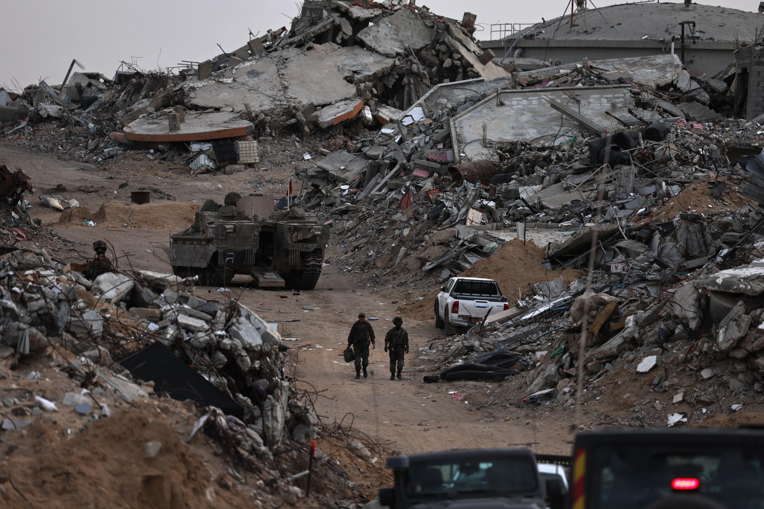 epa12580590 A photo taken while embedded with the Israeli Army and cleared by Israeli military censors shows Israeli soldiers from the special unit Yahalom next to an underground tunnel in the Al-Shaboura neighborhood in Rafah, southern Gaza Strip...