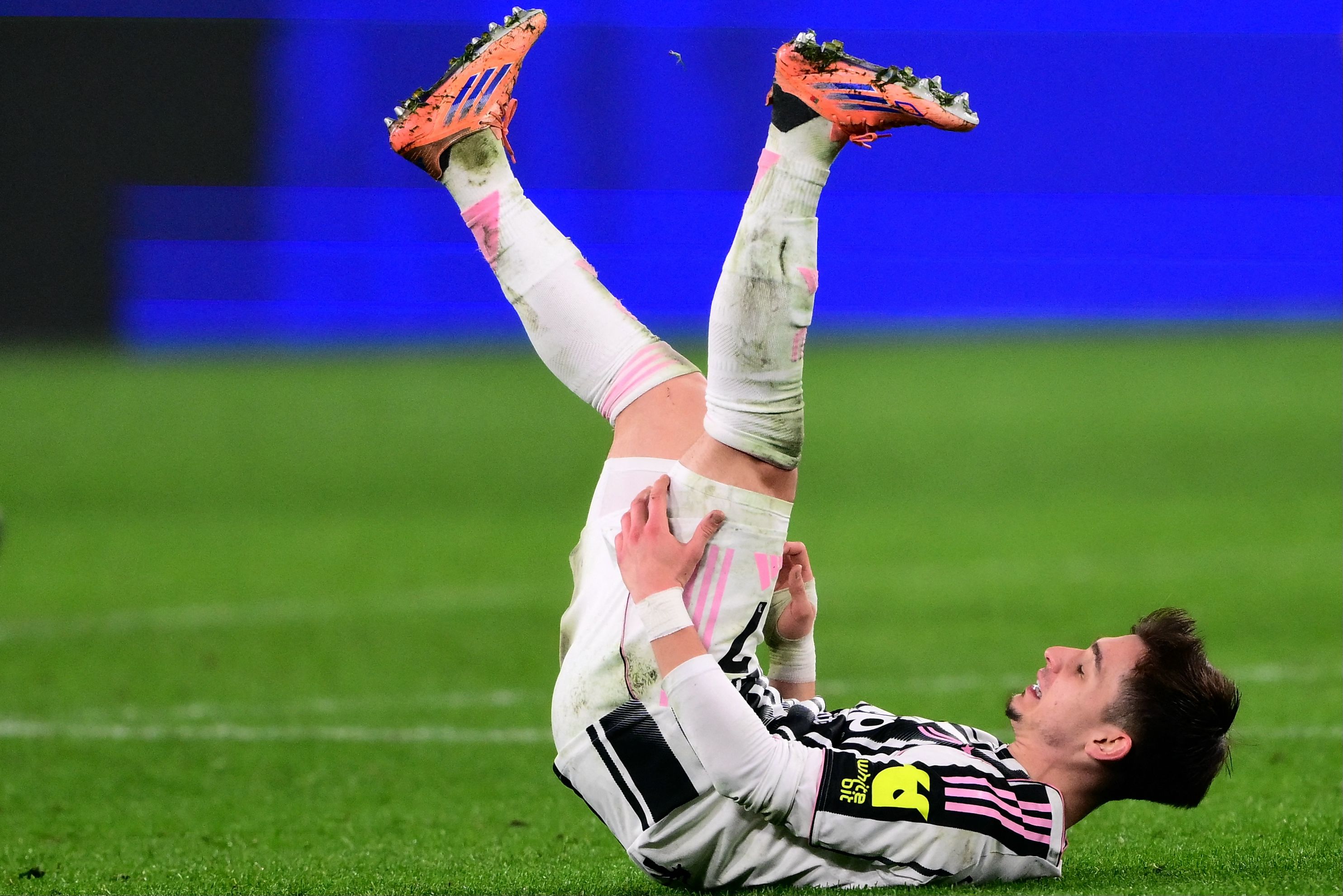 Juventus' Portuguese forward #07 Francisco Chico Conceicao holds his hamstring as he lies on the pitch during the Italian Serie A football match between Juventus and AS Roma at the Allianz stadium in Turin, northern Italy, on December 20, 2025. (P...