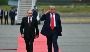 epa02967634 Protestors wave painted US and Europe flags during the demonstration