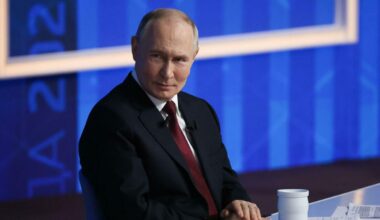 TOPSHOT - In this handout photograph taken on December 17, 2025 and released on December 18, 2025 by the press service of the 24th Mechanized Brigade of Ukrainian Armed Forces, people walk in a street of a heavily damaged residential area of the...