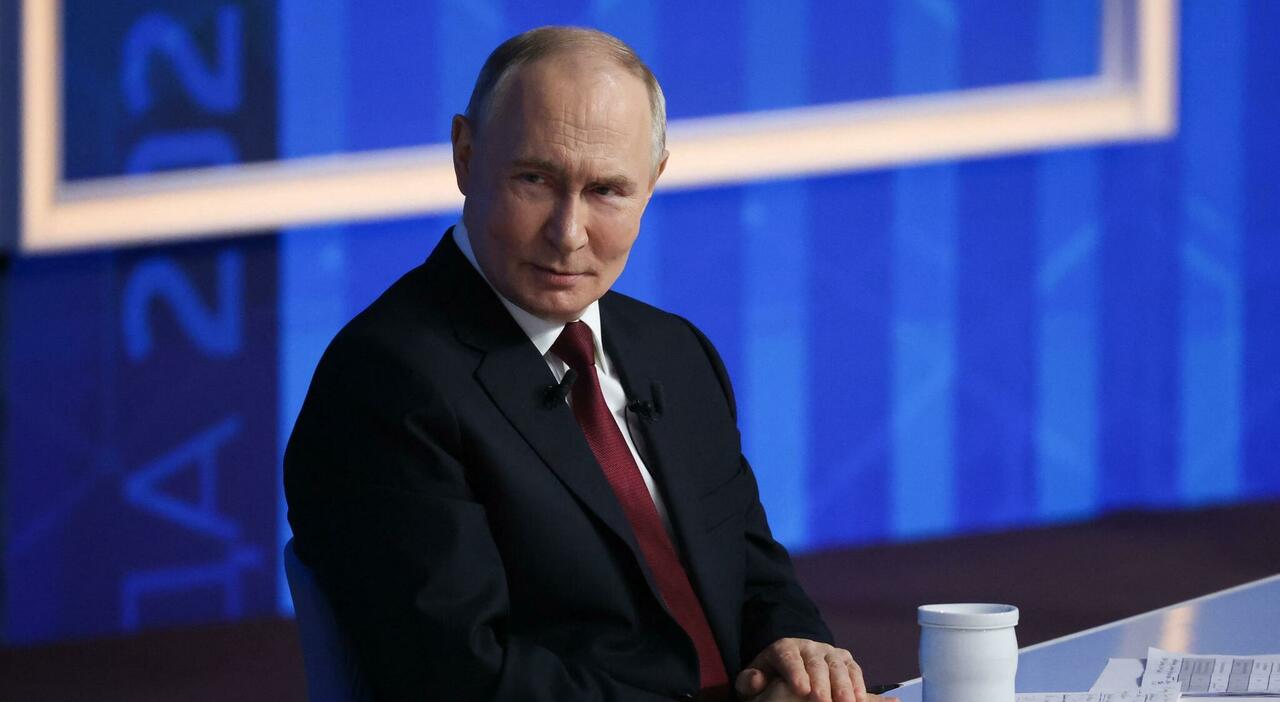 TOPSHOT - In this handout photograph taken on December 17, 2025 and released on December 18, 2025 by the press service of the 24th Mechanized Brigade of Ukrainian Armed Forces, people walk in a street of a heavily damaged residential area of the...