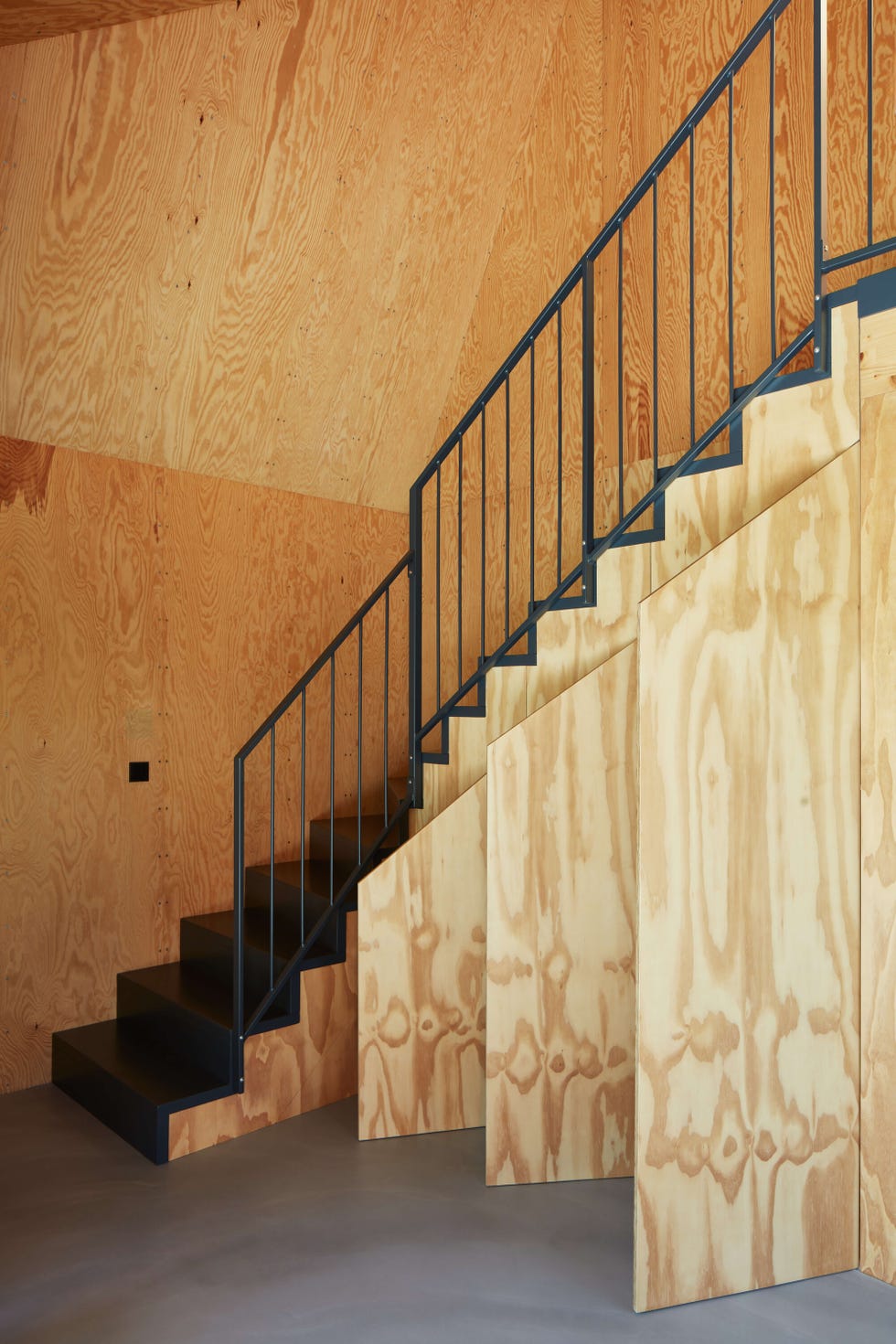 staircase in a wooden interior setting with a metal railing