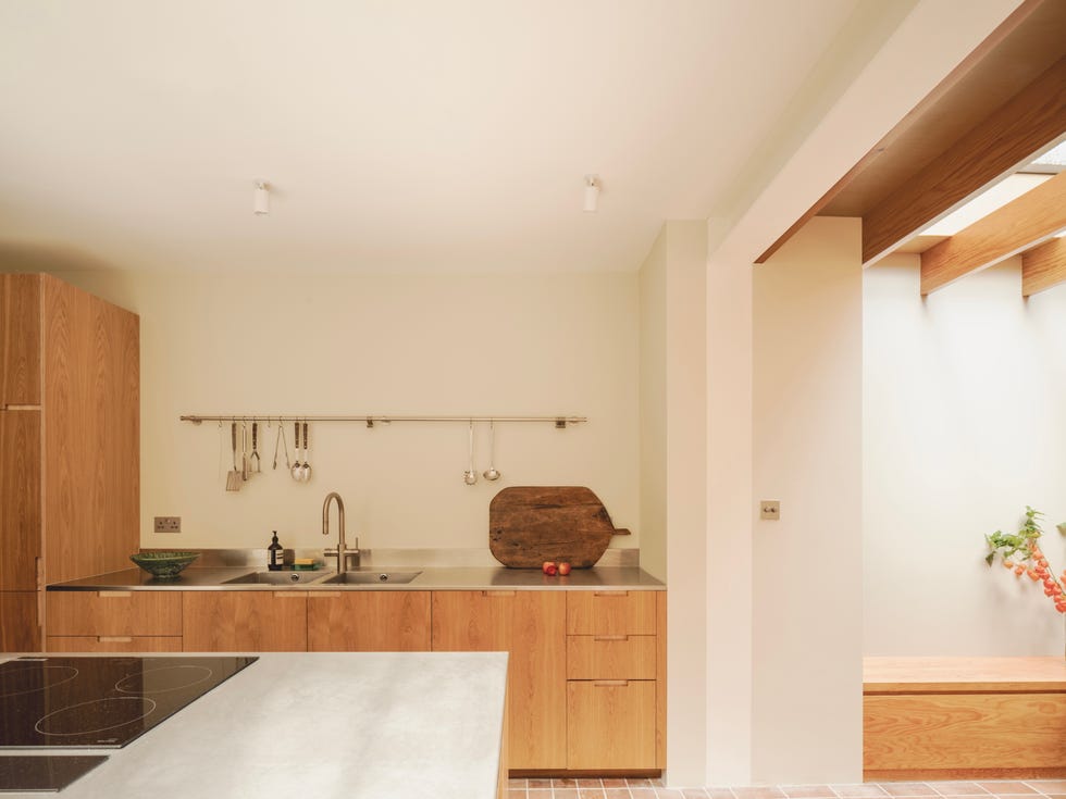 reforma de bajo en casa adosada ladrillo y madera