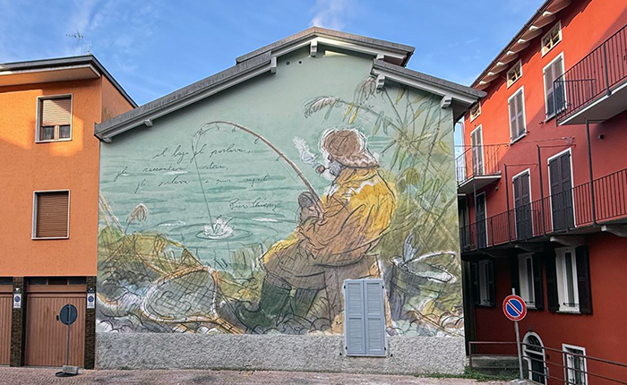 Luino Notizie | Una parete accende il centro storico: a Luino un grande murales dedicato a Piero Chiara
