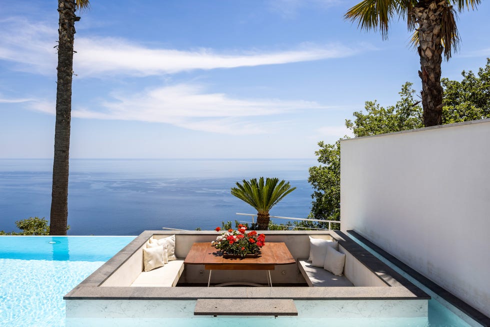outdoor seating area with a view of the sea