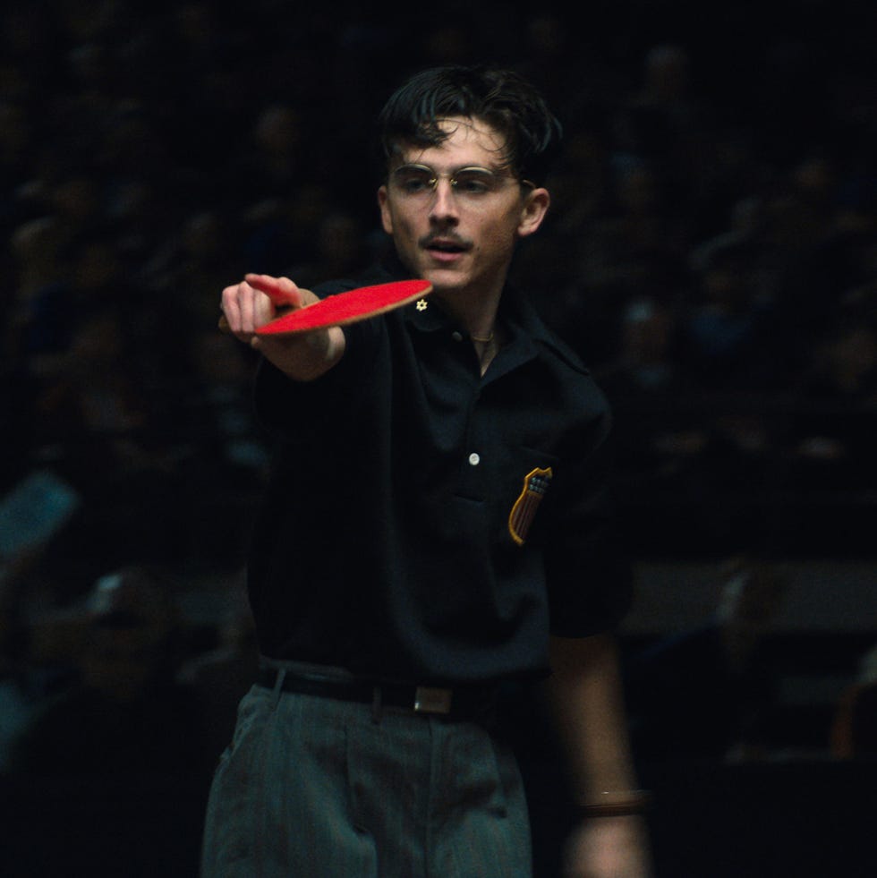 Referee displaying a red card during a sporting event.
