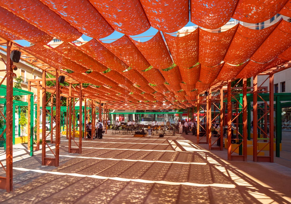 urban space with a patterned canopy and gathering areas