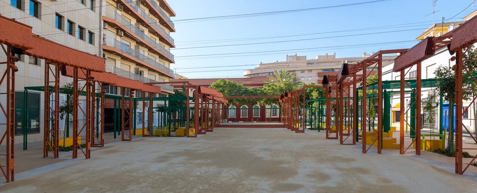 urban plaza with shelter structures and seating areas