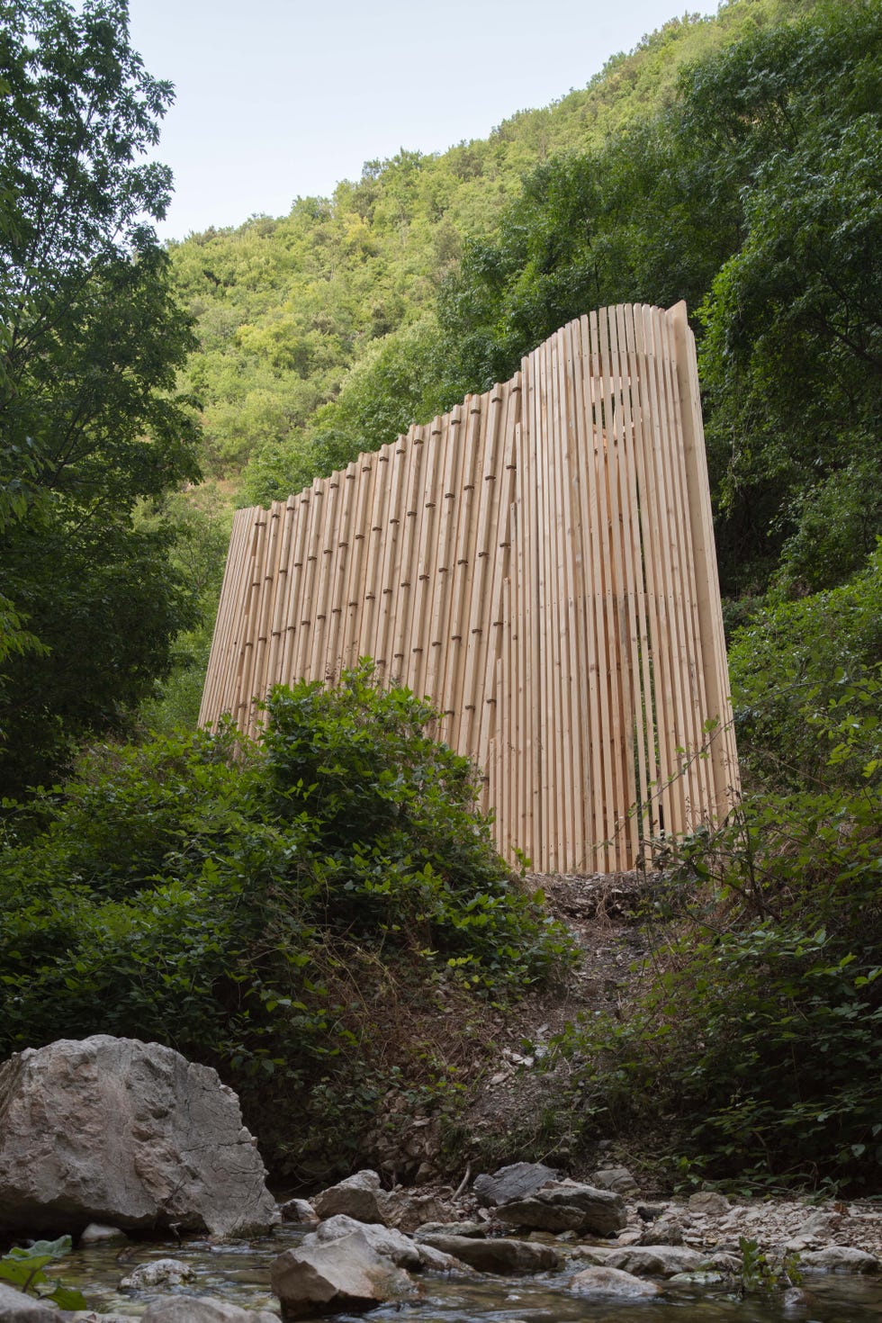 wooden structure integrated into a natural landscape