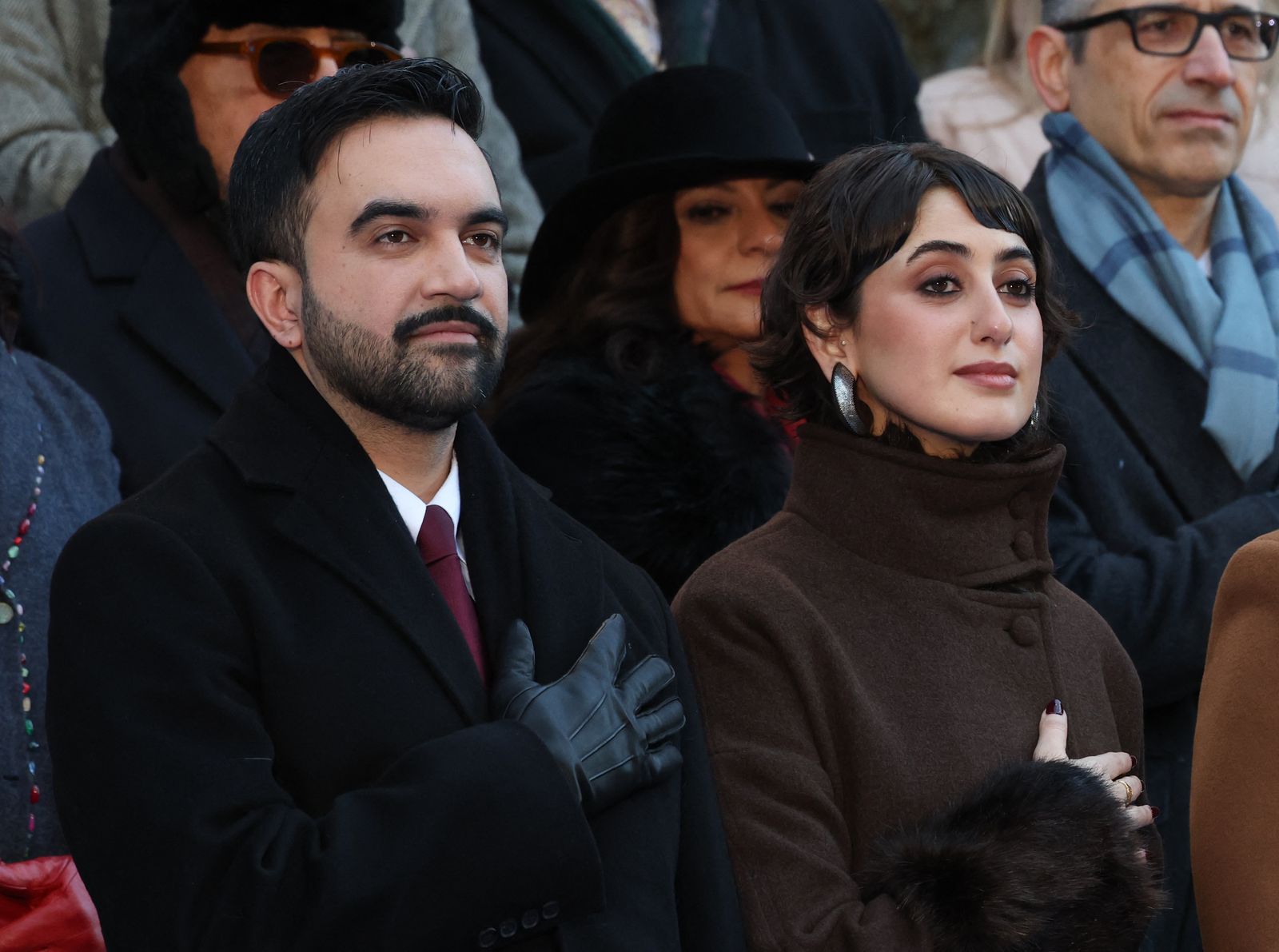 New York mayor Zohran Mamdani and his wife Rama Duwaji listen to the national anthem during his public inauguration...