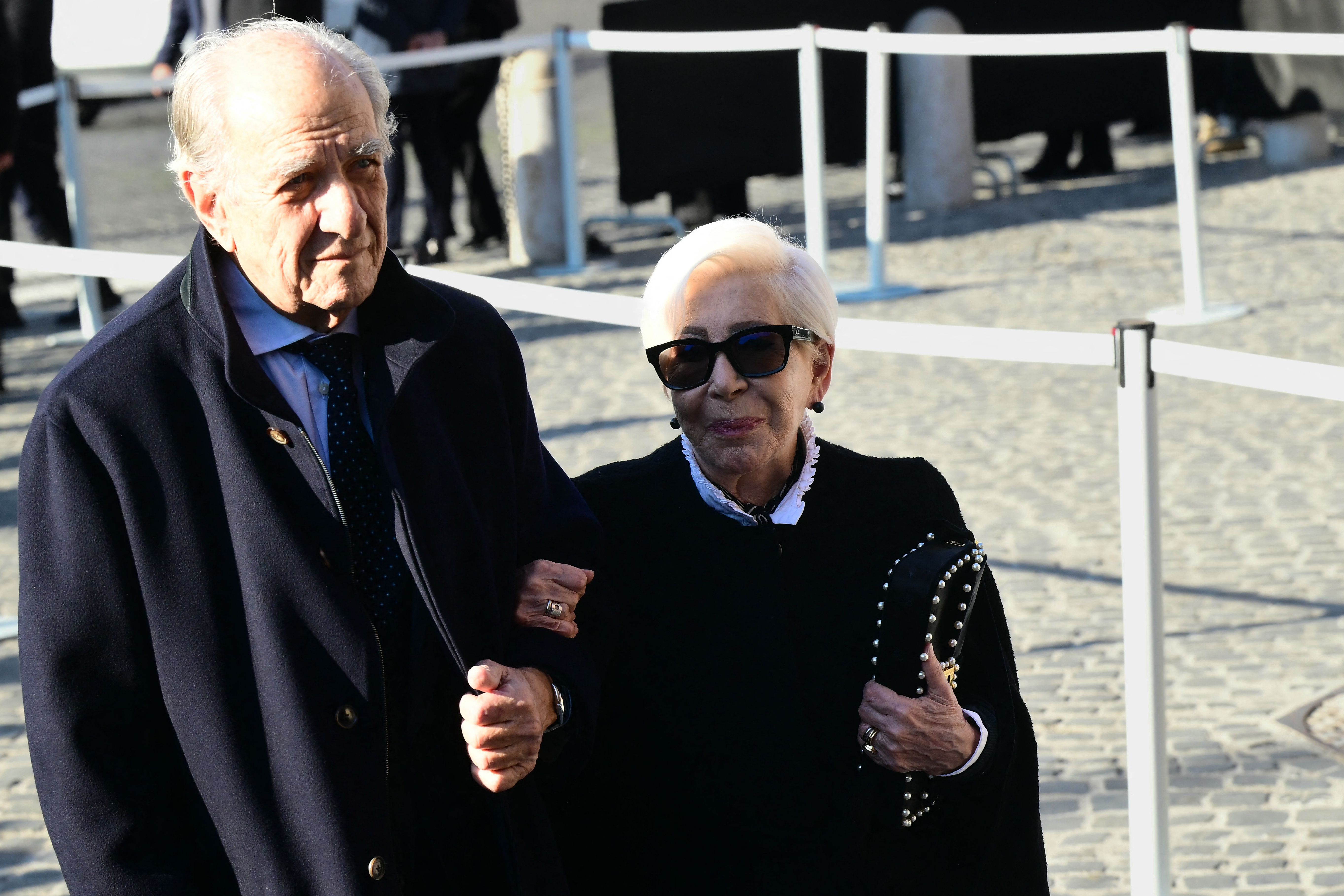 Italian fashion designer and entrepreneur Anna Fendi (R) arrives at the funeral ceremony for the late Italian fashion designer Valentino Gavarani at the Basilic of Santa Maria degli Angeli e dei Martiri, in Rome on January 23, 2026. (Photo by Stef...