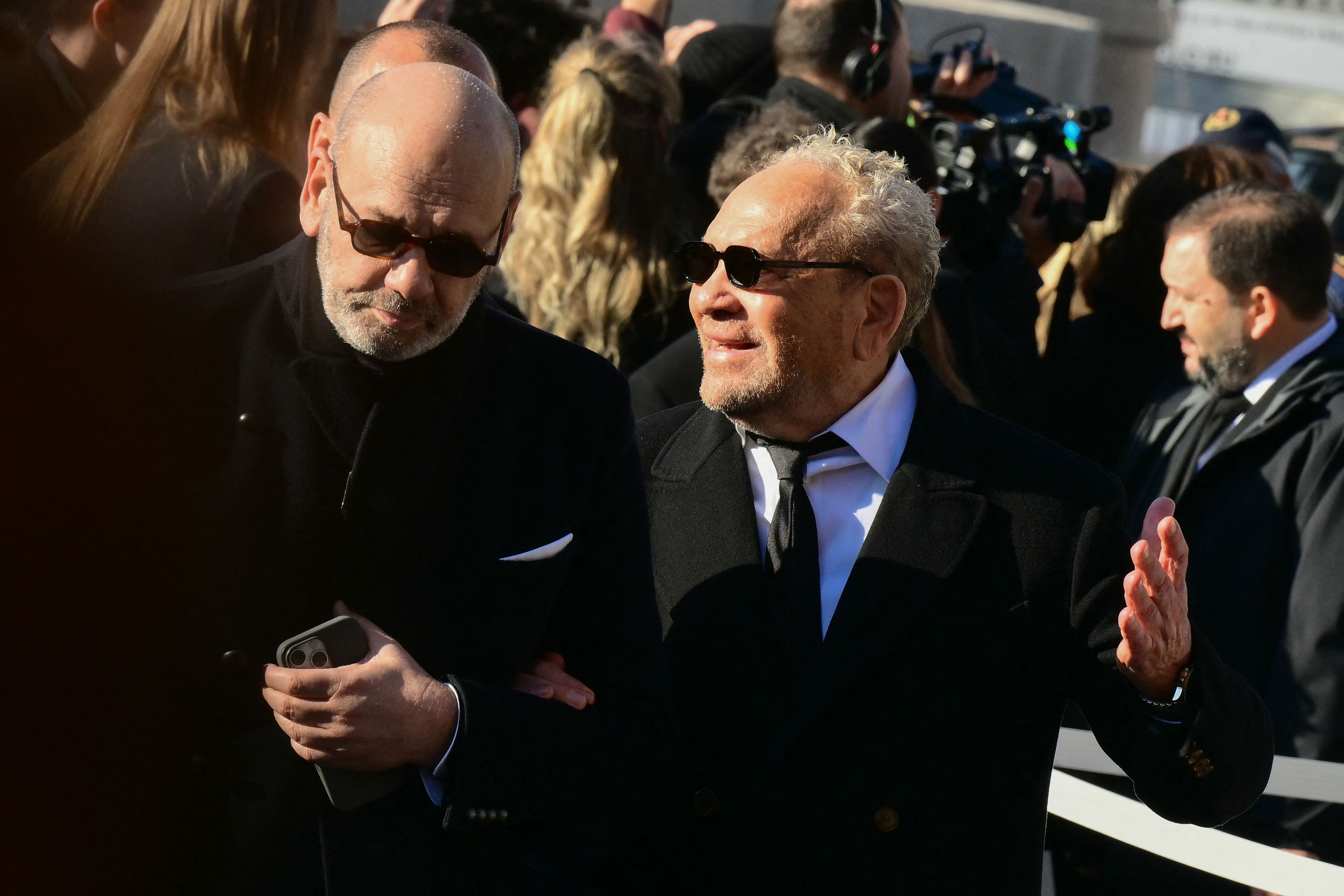 Italian fashion designer Ermanno Scervino (R) arrives at the funeral ceremony for the late Italian fashion designer Valentino Gavarani at the Basilic of Santa Maria degli Angeli e dei Martiri, in Rome on January 23, 2026. (Photo by Stefano RELLAND...