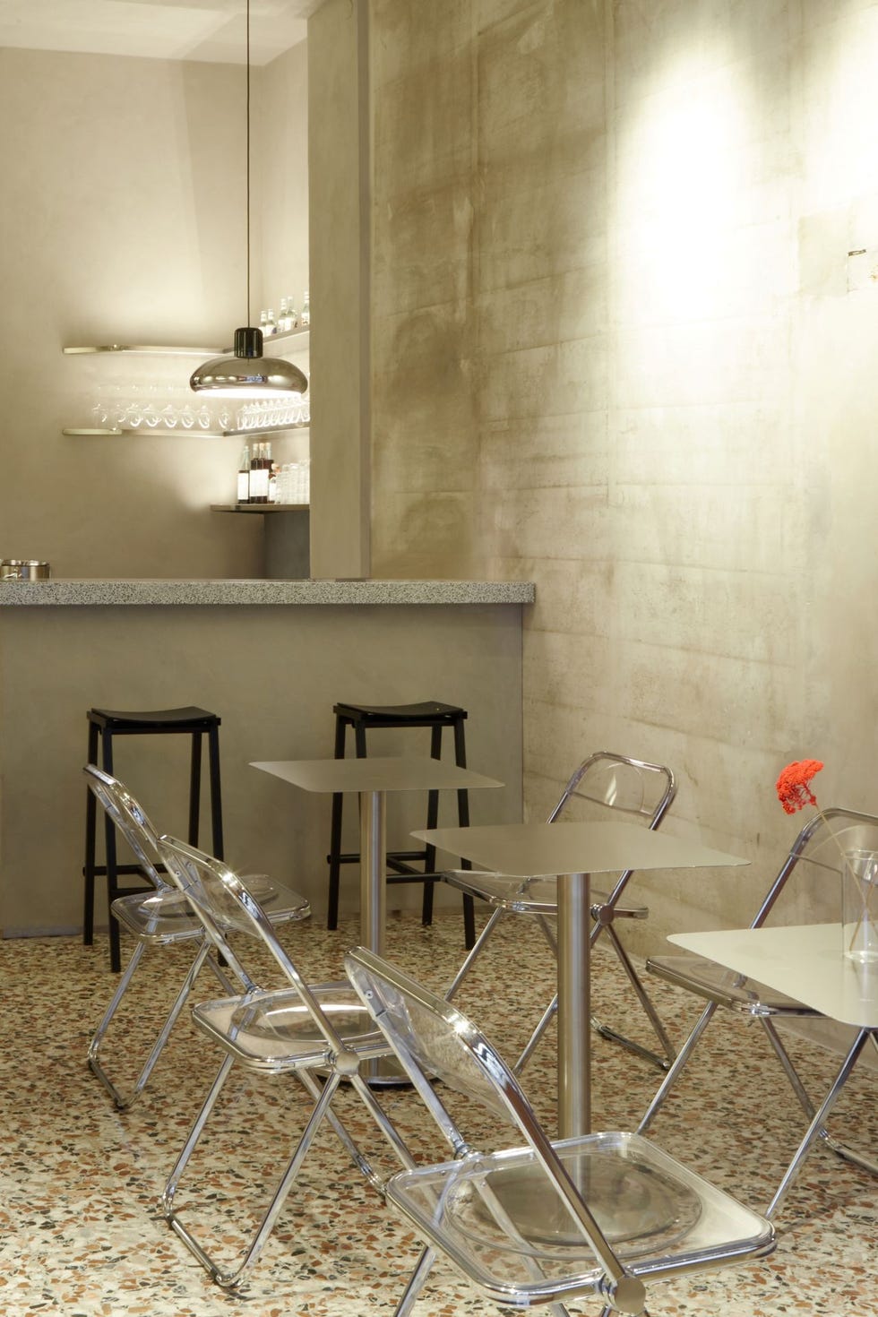 modern café interior with clear chairs and a bar