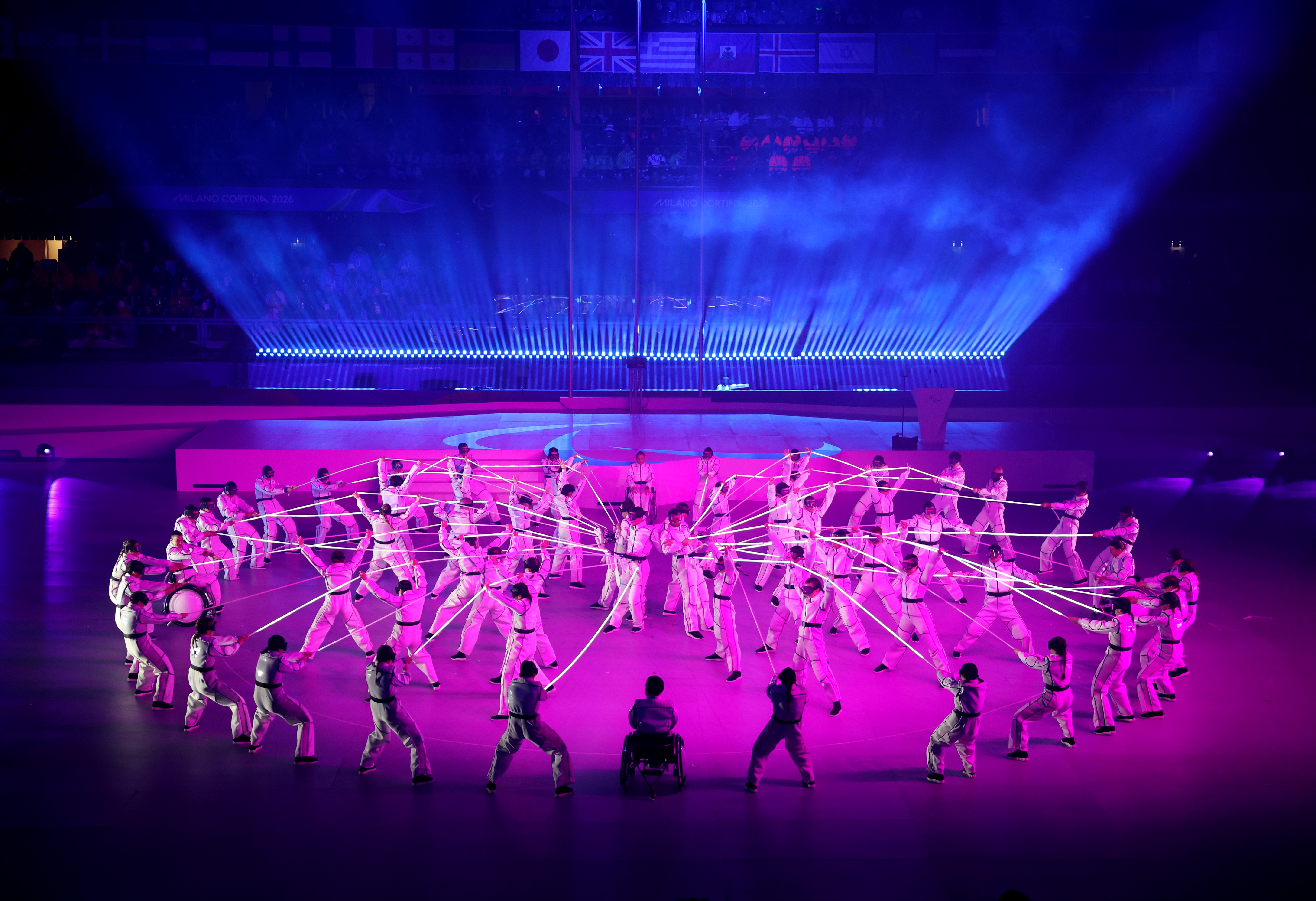 CORTINA D'AMPEZZO, ITALY - MARCH 15: Performers dance with luminous ropes during the Milano Cortina 2026 Winter Paralympic Games closing ceremony at Cortina Curling Olympic Stadium on March 15, 2026 in Cortina d'Ampezzo, Italy. (Photo by Maja Hiti...