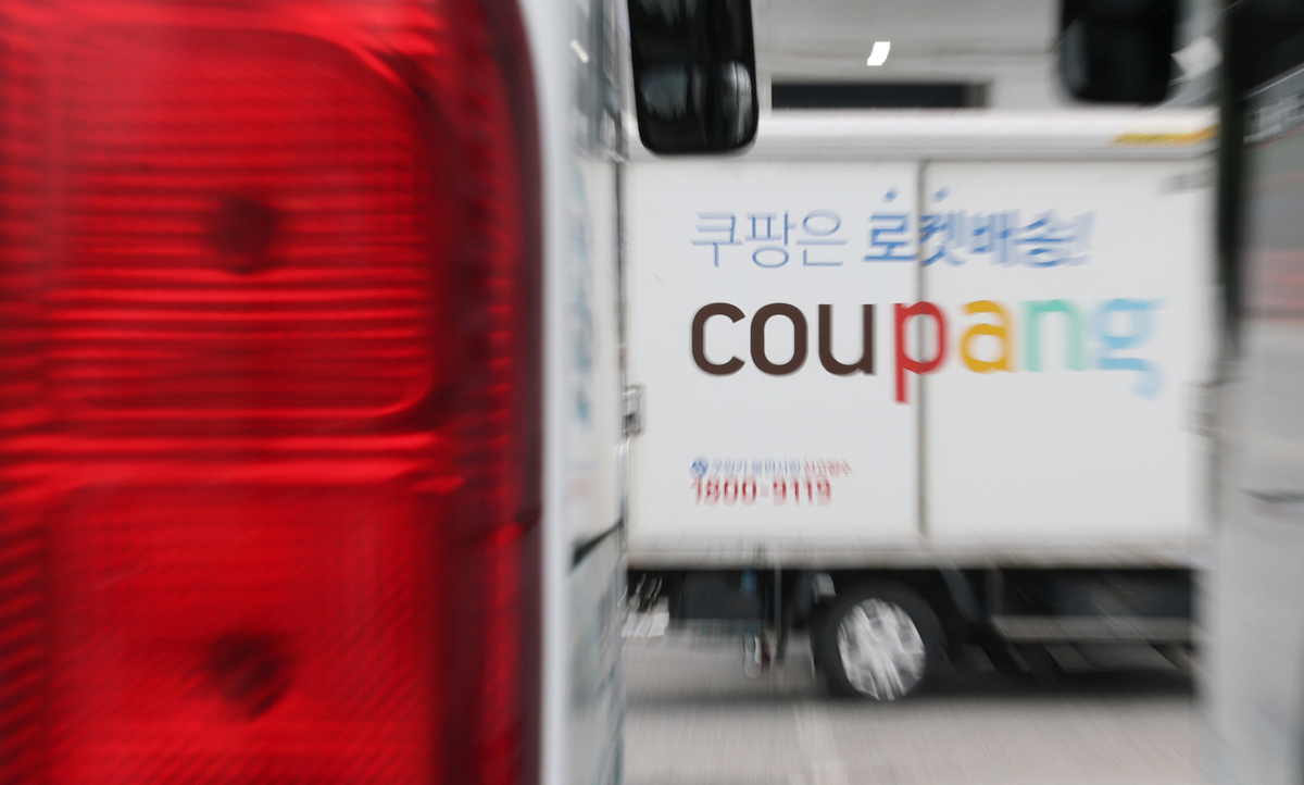 Delivery trucks wait at a Coupang logistics center in Seoul. Yonhap News - Seoul Economic Daily Finance News from South Korea