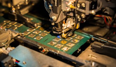 A robotic machine manufactures a semiconductor chip at a stall to show investors during The Advantage Assam 2.0 Investment Summit in Guwahati, India, on February 25, 2025. (Photo by David Talukdar/NurPhoto via Getty Images)