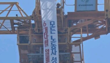 A Hanwha Ocean subcontracted worker stages a high-altitude protest atop a crane at a scaffolding assembly yard inside the company's Geoje plant in Gyeongsangnam-do on Aug. 30. /Geoje Tongyeong Goseong Shipbuilding Subcontractors Branch of the Korean Metal Workers' Union - Seoul Economic Daily Finance News from South Korea