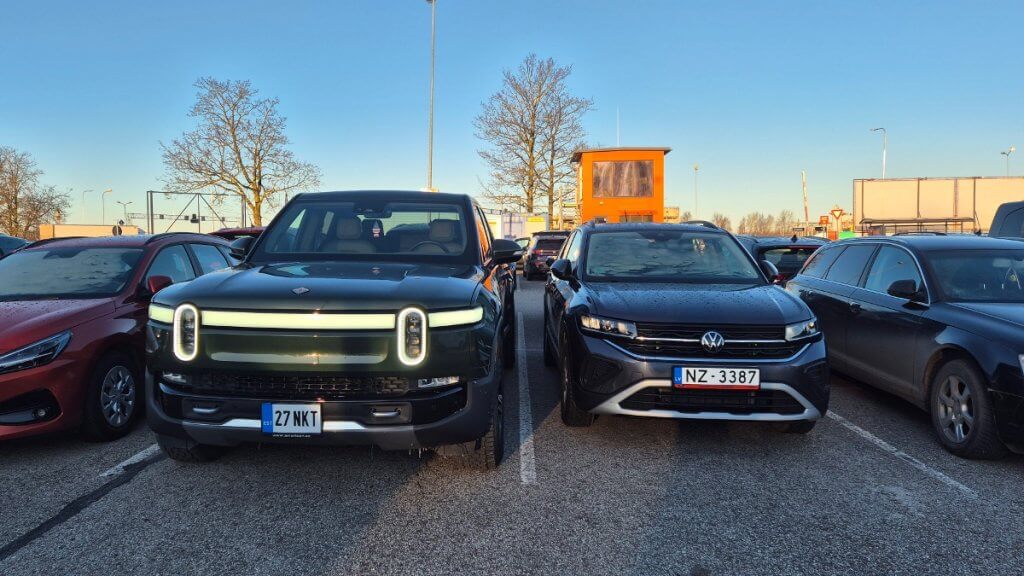 Rivian R1T next to Volkswagen T-Cross