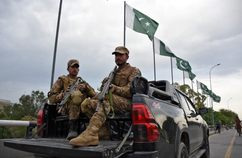 Army soldiers patrol a road as Pakistan prepares to host U.S. and Iran for the second round of peace talks in Islamabad, Pakistan, April 24, 2026.
