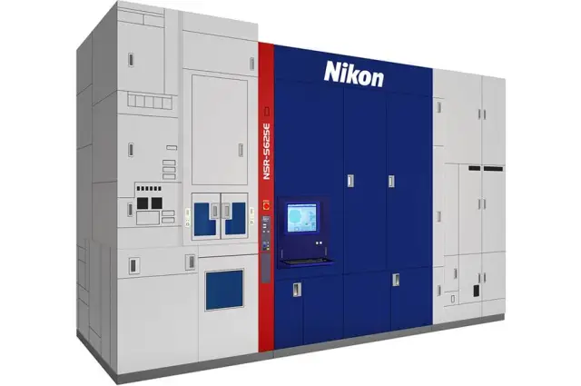 A large, industrial Nikon NSR-S625E semiconductor lithography system with a modular paneled design in white, dark blue, and a red vertical accent strip featuring a small control monitor.