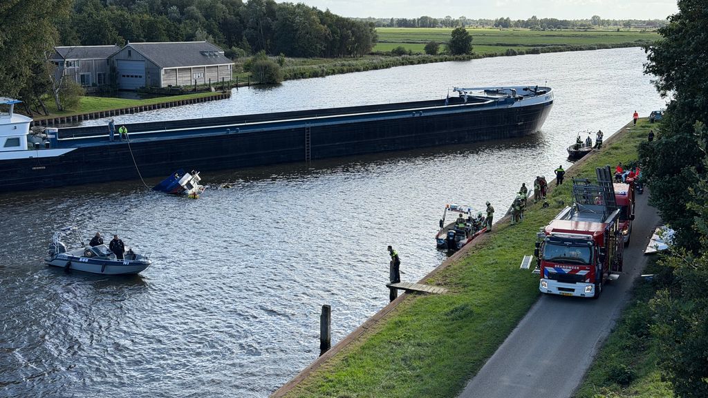Aanvaring binnenvaartschip en jacht in Fries kanaal, twee personen uit water gehaald