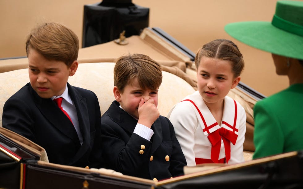 topshot britains prince george of wales (l), britains prince louis of wales (c) and britains princess charlotte of wales (r) arrive in a horse drawn carriage on horse guards parade for the kings birthday parade, trooping the colour, in london on june 17, 2023. the ceremony of trooping the colour is believed to have first been performed during the reign of king charles ii. since 1748, the trooping of the colour has marked the official birthday of the british sovereign. over 1500 parading soldiers and almost 300 horses take part in the event. (photo by daniel leal / afp) (photo by daniel leal/afp via getty images)