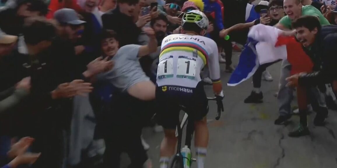 Toeschouwers belagen Pogacar op EK wielrennen: trappende beweging en stickers op rug