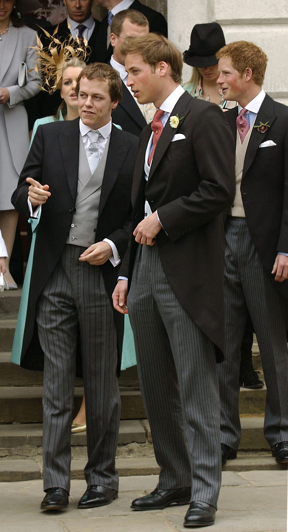 tom parker bowles (l) speaks with prince william (c) as prince harry watches as thier parents prince charles and his wife the duchess of cornwall, formerly camilla parker bowles leave the guildhall where their royal wedding was celebrated, 09 april, 2005, in windsor.prince charles and his longtime sweetheart camilla parker bowles married today after two months of muddled preparations and a lifetime of waiting. afp photo eric feferberg (photo by carl de souza / afp)