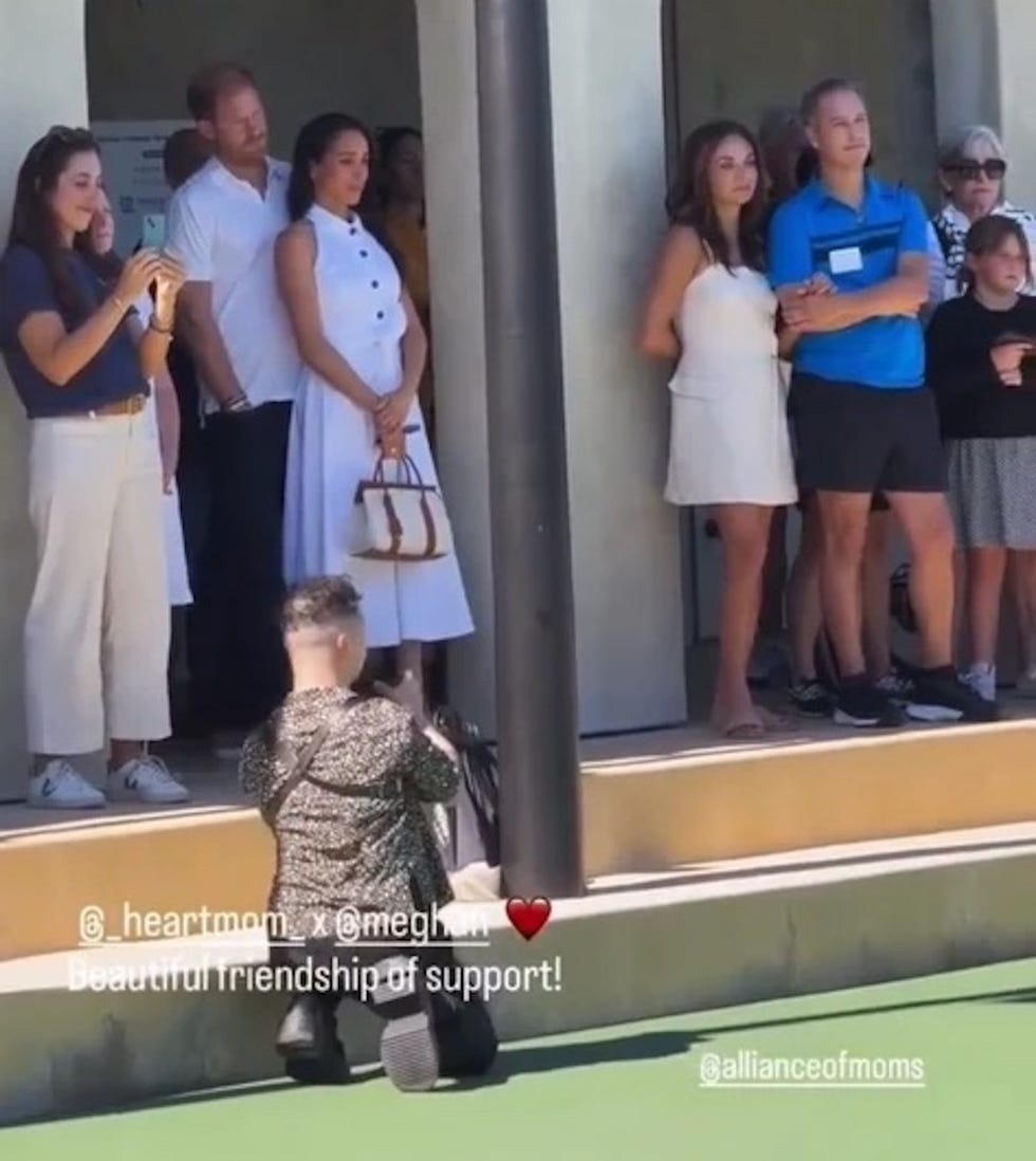 group of people standing on steps during an event group of people standing on steps during an event