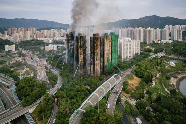 epa12551666 Smoke billows from an apartment fire in the Tai Po district of Hong Kong, China, 27 November 2025. The fire, which started on 26 November, has killed at least 44 people, and left 279 missing.