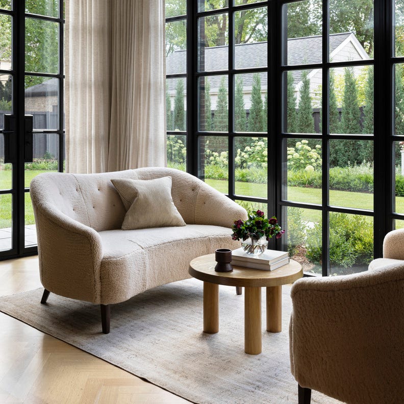 hold the line elegant design\, neutral color palette chicago home designed by wendy labrum with michael abraham architecture inspiration english country estate with a contemporary twist sunroom pendant lamps rose uniacke draperies nobilis sofas custom, in edelman leather shearling large windows, sunny spaces, bright decor 