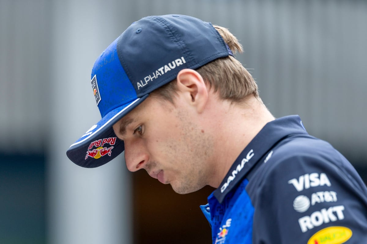 Max Verstappen looking down as he walks at the 2026 Monaco Grand Prix