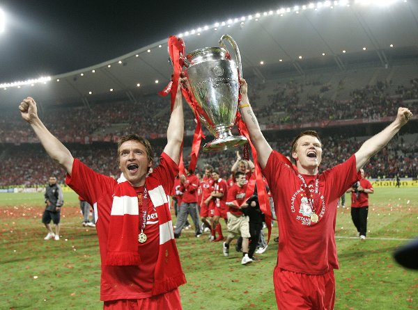 Liverpool's Vladimir Smicer, left, and John Arne Riise hold the trophy aloft after the UEFA Champions League Final between AC Milan and Liverpool at the Ataturk Olympic Stadium in Turkey, Istanbul Wednesday May 25, 2005. Liverpool won 3-2 on penalties after the match finished 3-3 after extra time.  (AP Photo/Thomas Kienzle)